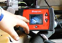 Gearbox Rebuilders Sheffield gearbox builder using tiny camera mounted on a coil which is fed into a car gearbox